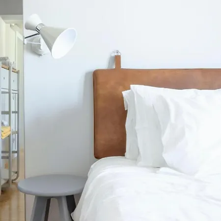 Plum Guide - The Historical Collage Apartment Lisbon